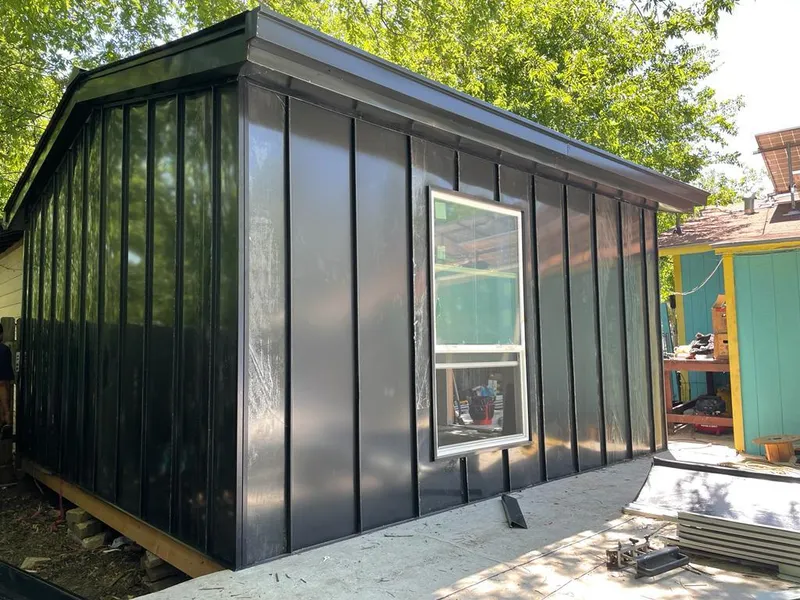 Black standing seam metal wall panels for Metal Roof Installation in Marlene Village